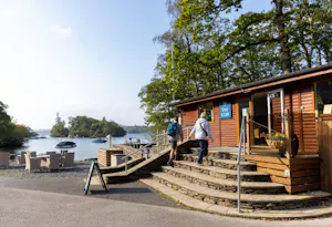 Couple walking to the shop at Hill of Oaks Lodge and Caravan Park